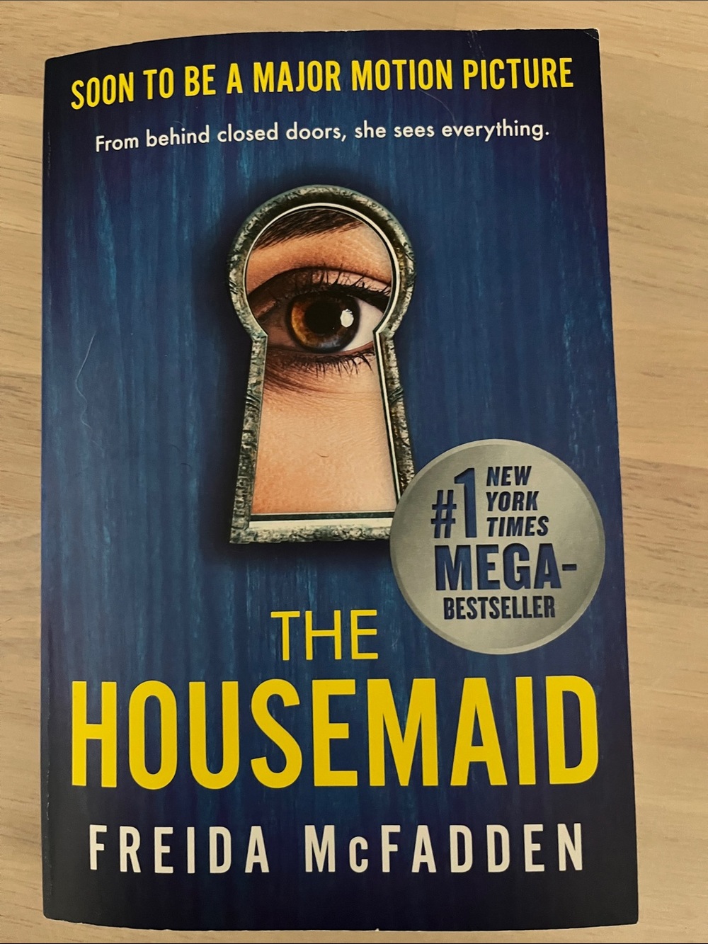The Housemaid by Freida McFadden - Blue & Yellow Paperback